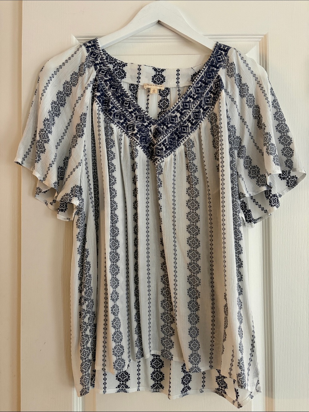 White Tunic with Navy Embroidered V-Neck